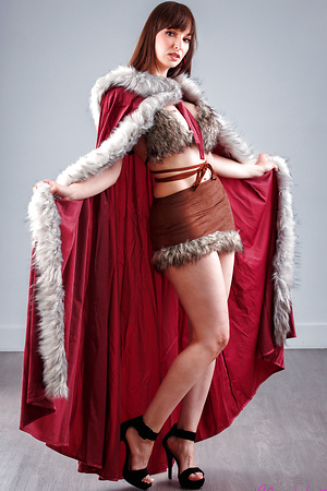 Madpornpics - Playful milf strips her Christmas cloak to flash her perky tits