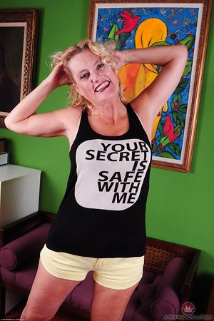 Madpornpics - Splendid granny is having a very good time undressing her ass and spreading her pink cave for us