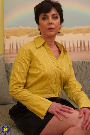 Naughty housewife playing with herself on the couch