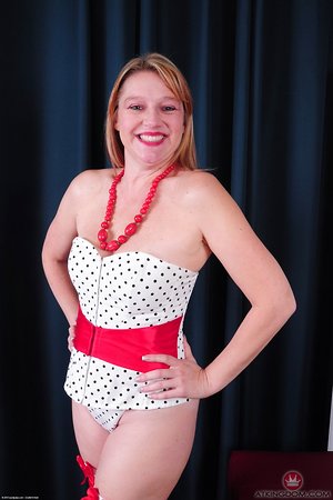 This outstanding blonde girl with awesome tits is wearing her white stockings to look so damn sexy.