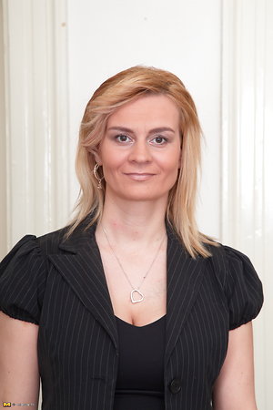 This incredible blonde mom is touching her impressive tits and wonderful pussy that was dressed in panties.