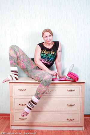 Mature with hairy pussy fondles clitoris vibrator