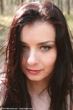 She took off her clothes and walking around naked in her stocking feet in the forest