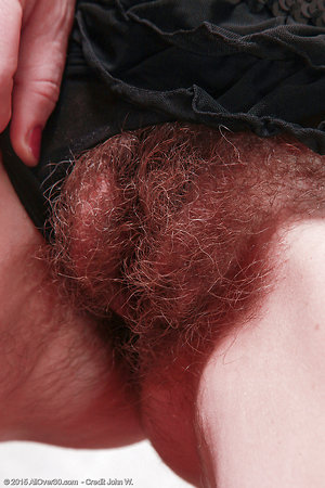 She pulls the tights and removes her panties and there you will see a lot of hair on her pussy