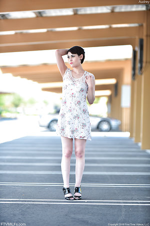 Beauty in floral dress bares body for small tits milf pics