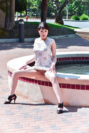 Beauty in floral dress bares body for small tits milf pics