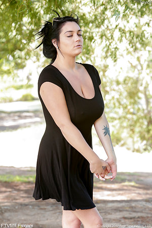 Appetizing brunette lady shows her huge mature tits off