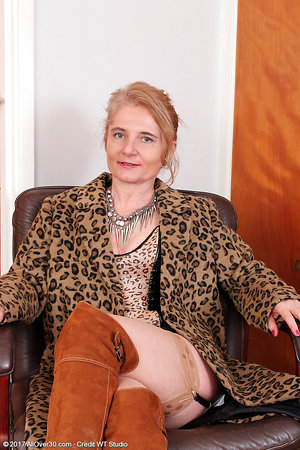 Sexy mom in high boots smokes and dreams of a young dick