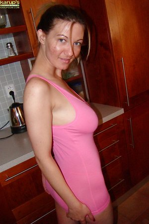 Naughty mature covers tits and butt with flour in kitchen