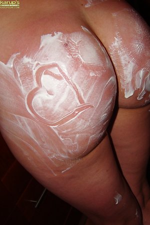 Naughty mature covers tits and butt with flour in kitchen