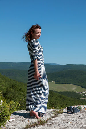 Petite hairy girl flashes muff after winning top of a rock